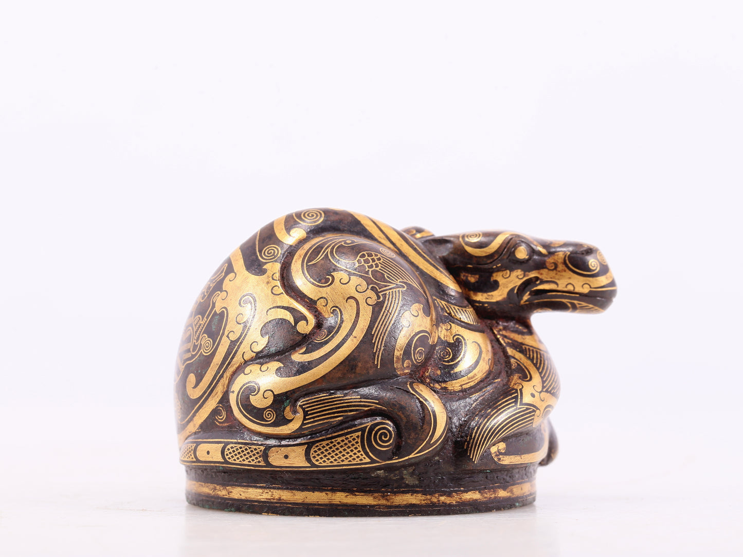 An exquisite bronze-inlaid auspicious animal ornament