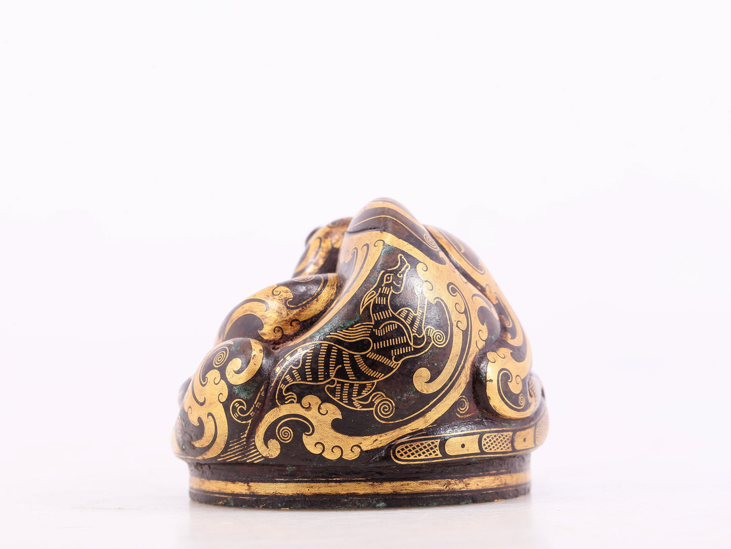 An exquisite bronze-inlaid auspicious animal ornament