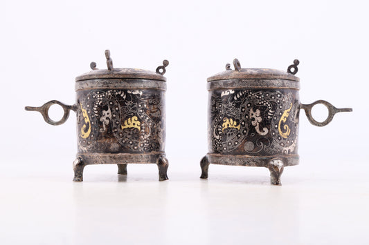 A pair of exquisite bronze inlaid gold and silver auspicious clouds and dragon pattern tripod jars with lids