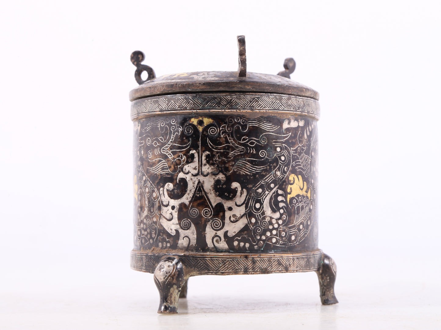 A pair of exquisite bronze inlaid gold and silver auspicious clouds and dragon pattern tripod jars with lids