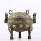 An exquisite bronze inlaid with gold and auspicious animal patterns with two ears and three legs with lid