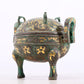 An exquisite bronze inlaid with gold and auspicious animal patterns with two ears and three legs with lid