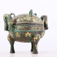 An exquisite bronze inlaid with gold and auspicious animal patterns with two ears and three legs with lid