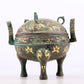 An exquisite bronze inlaid with gold and auspicious animal patterns with two ears and three legs with lid