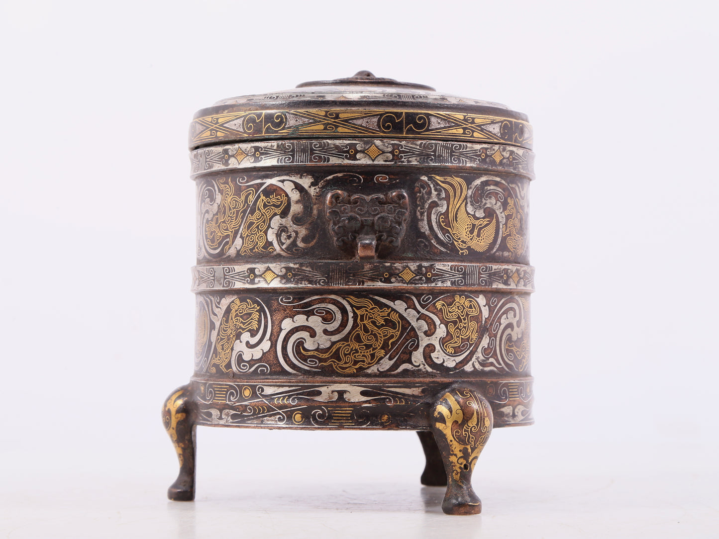 An exquisite bronze inlaid gold and silver tripod jar with auspicious clouds and animal patterns with lid