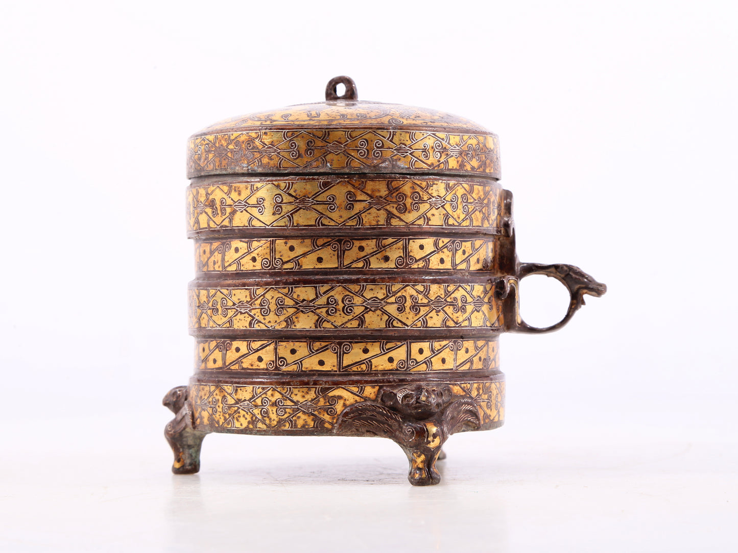 An exquisite bronze inlaid gold and silver tripod jar with auspicious animal patterns and lid