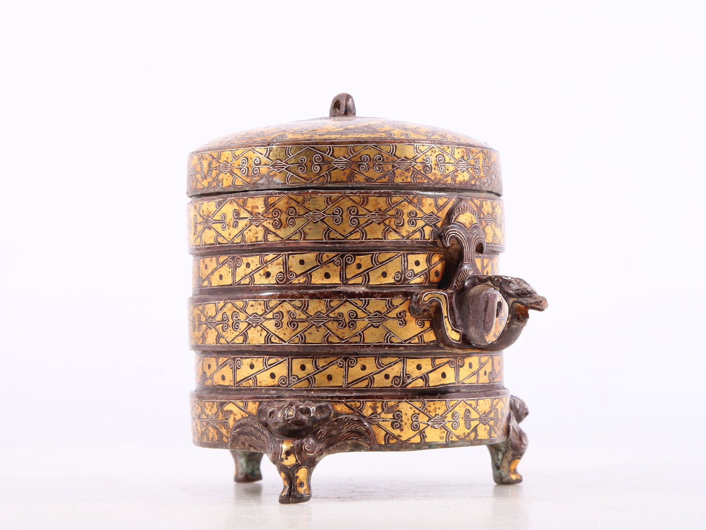 An exquisite bronze inlaid gold and silver tripod jar with auspicious animal patterns and lid