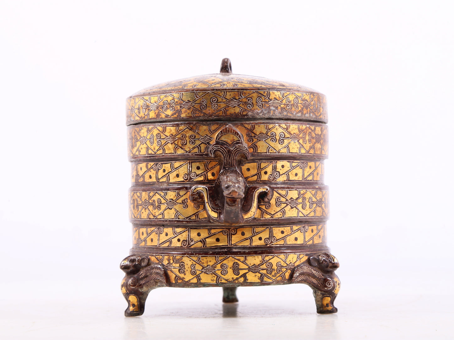 An exquisite bronze inlaid gold and silver tripod jar with auspicious animal patterns and lid