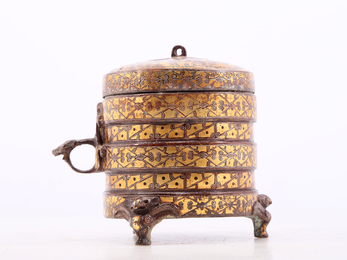 An exquisite bronze inlaid gold and silver tripod jar with auspicious animal patterns and lid