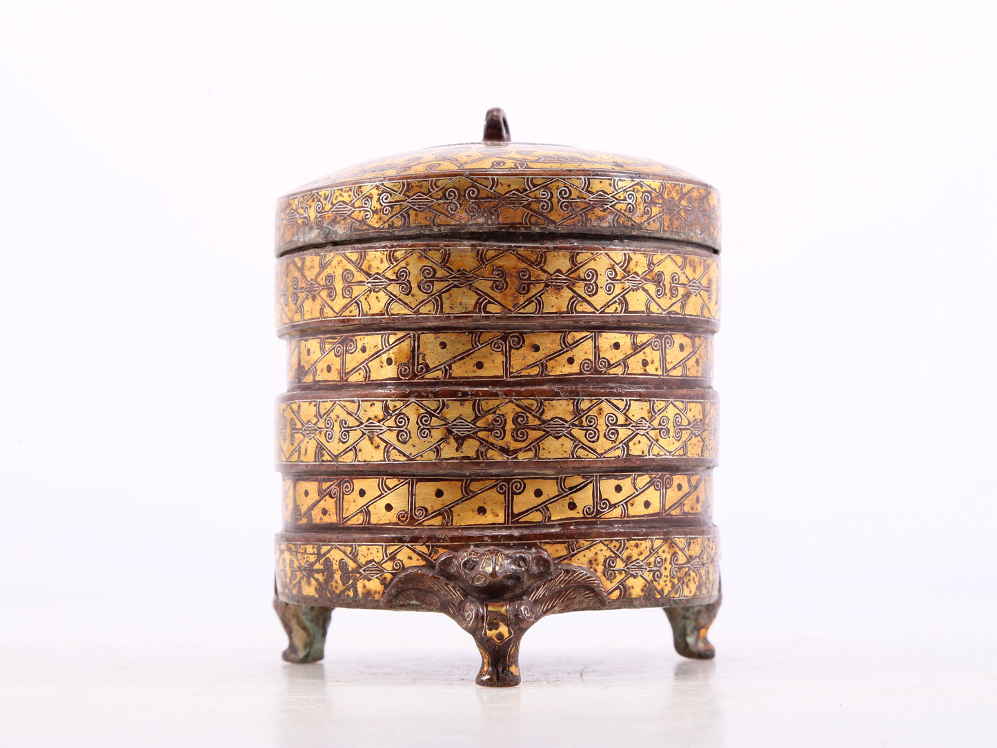 An exquisite bronze inlaid gold and silver tripod jar with auspicious animal patterns and lid