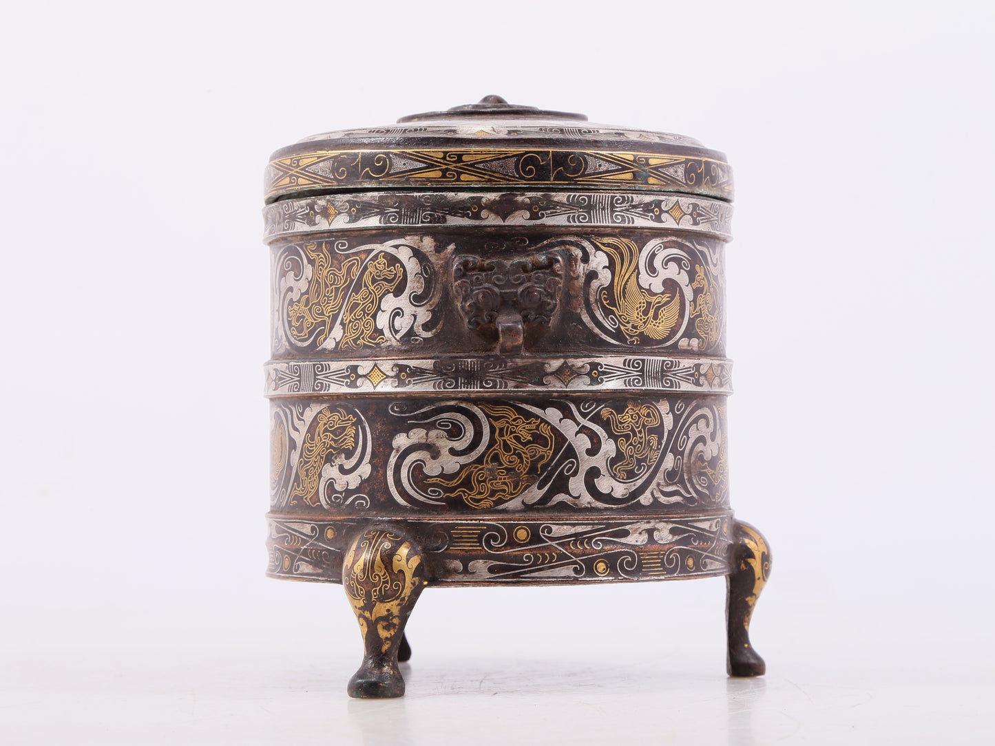 An exquisite bronze inlaid gold and silver tripod jar with auspicious clouds and animal patterns with lid