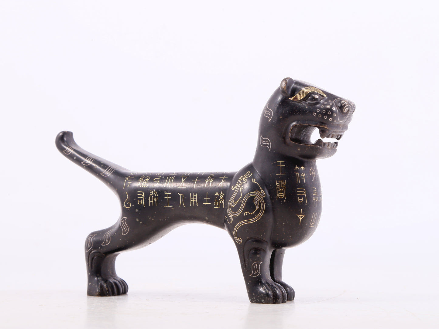 An exquisite bronze inlaid gold tiger charm