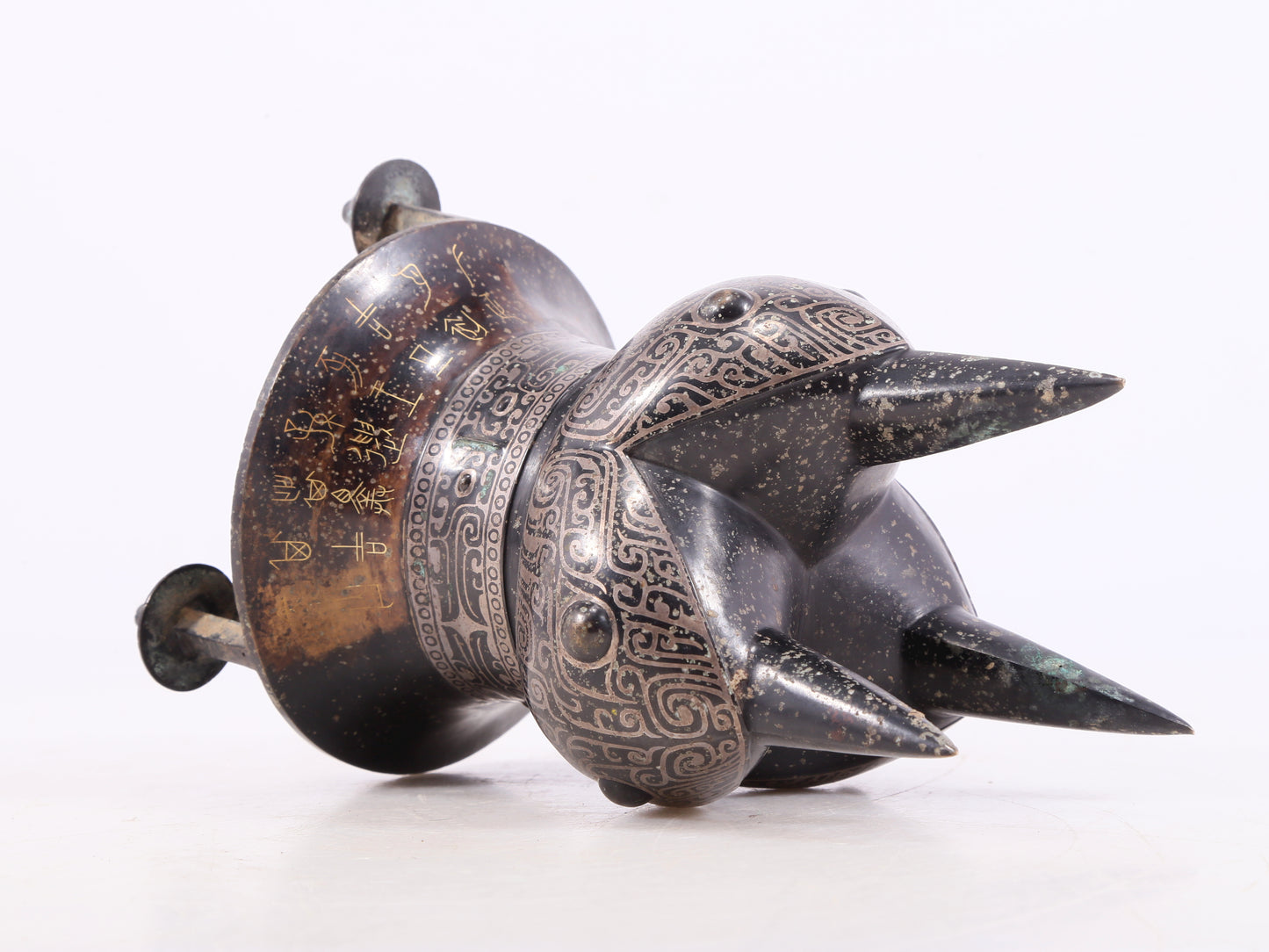 A Marvelous Bronze Gold& Silver-Mounted 'Animal Mask' Tripod Cup