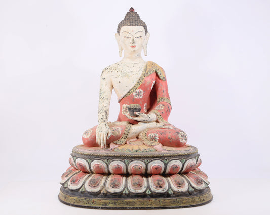 A solemn bronze painted statue of Gautama Buddha