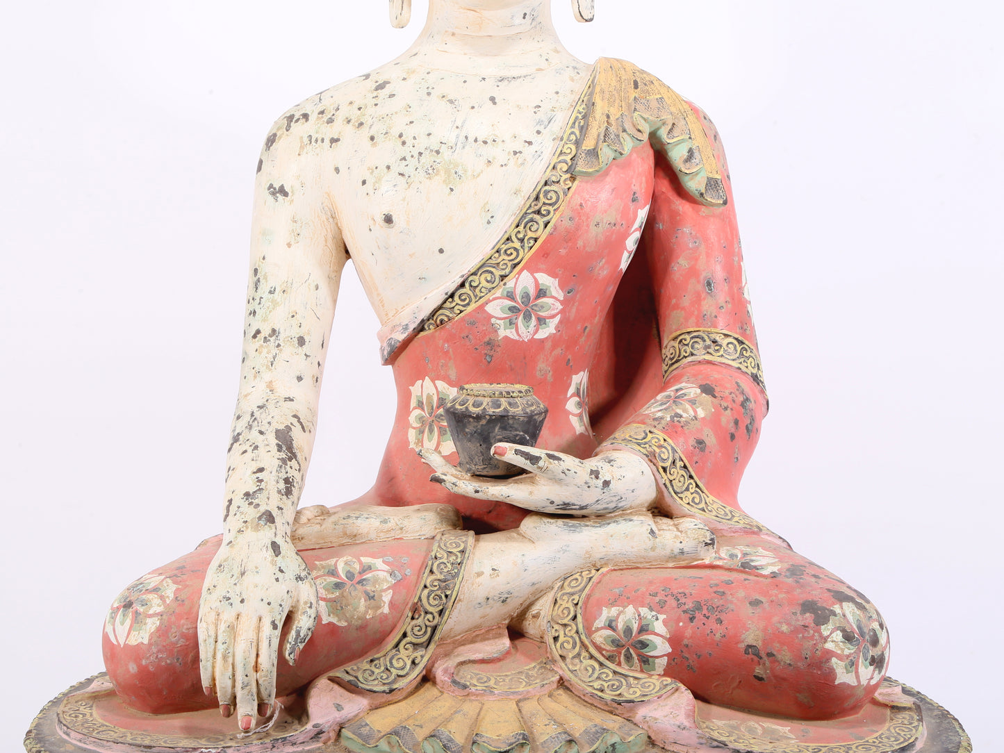 A solemn bronze painted statue of Gautama Buddha