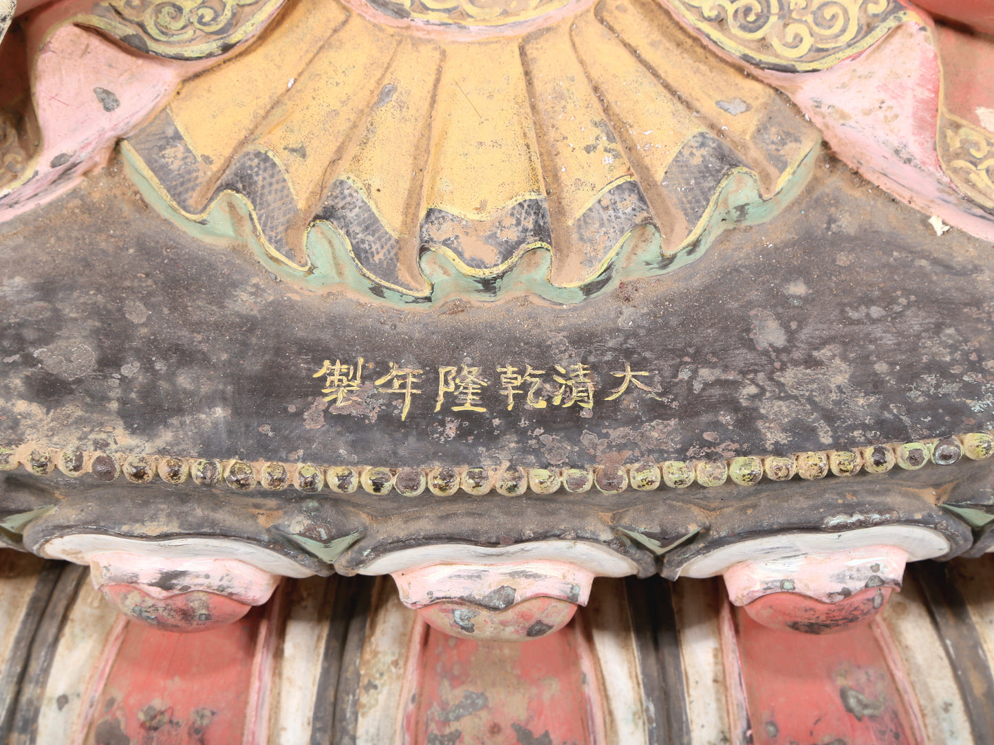 A solemn bronze painted statue of Gautama Buddha