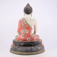 A solemn bronze painted statue of Gautama Buddha