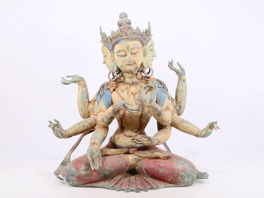 A solemn bronze painted eight-armed Guanyin statue