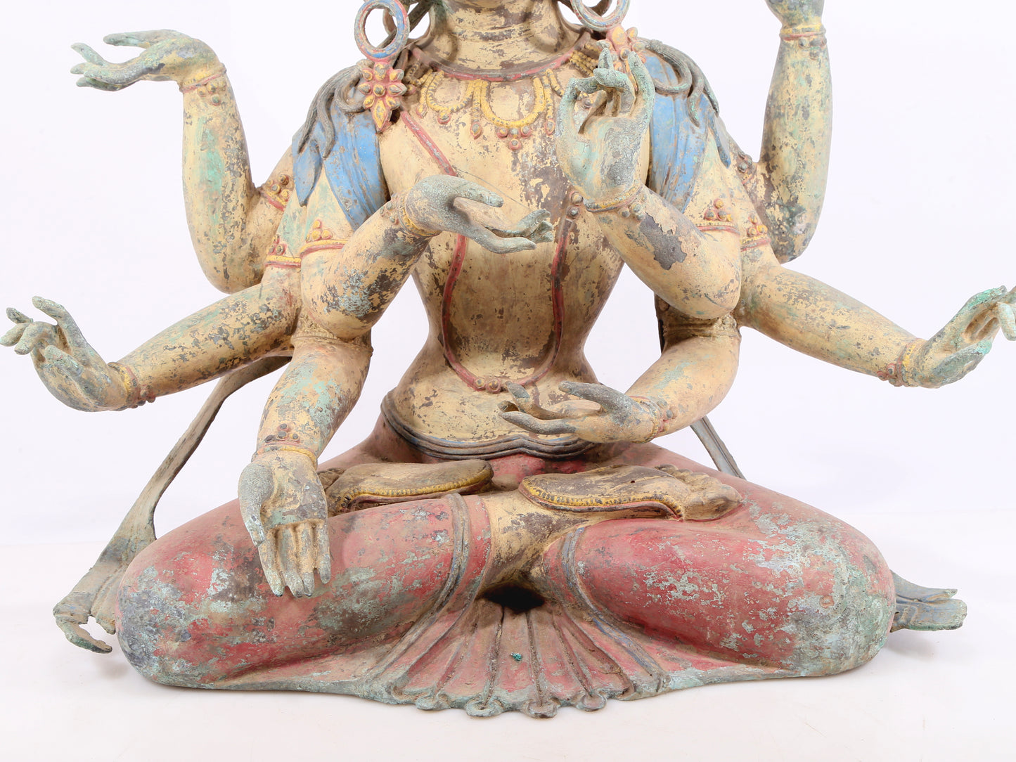 A solemn bronze painted eight-armed Guanyin statue