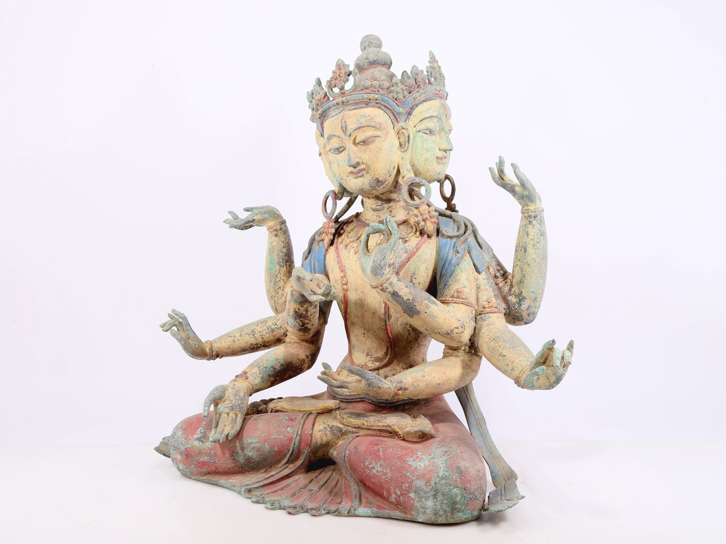 A solemn bronze painted eight-armed Guanyin statue