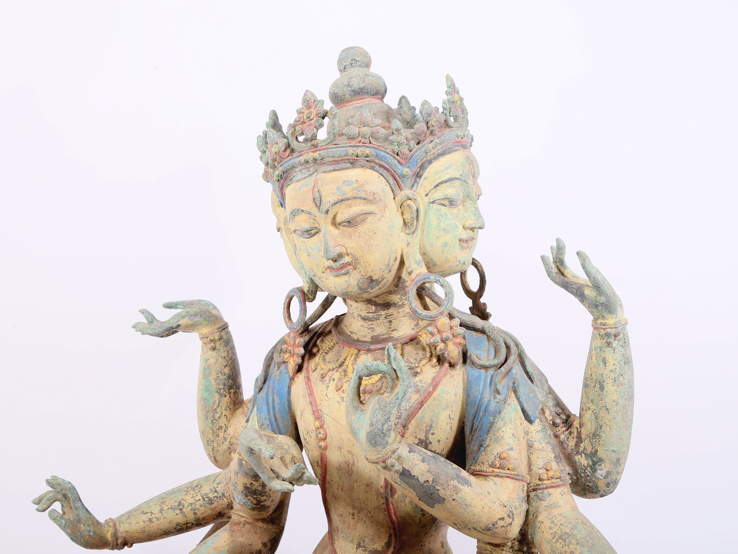 A solemn bronze painted eight-armed Guanyin statue