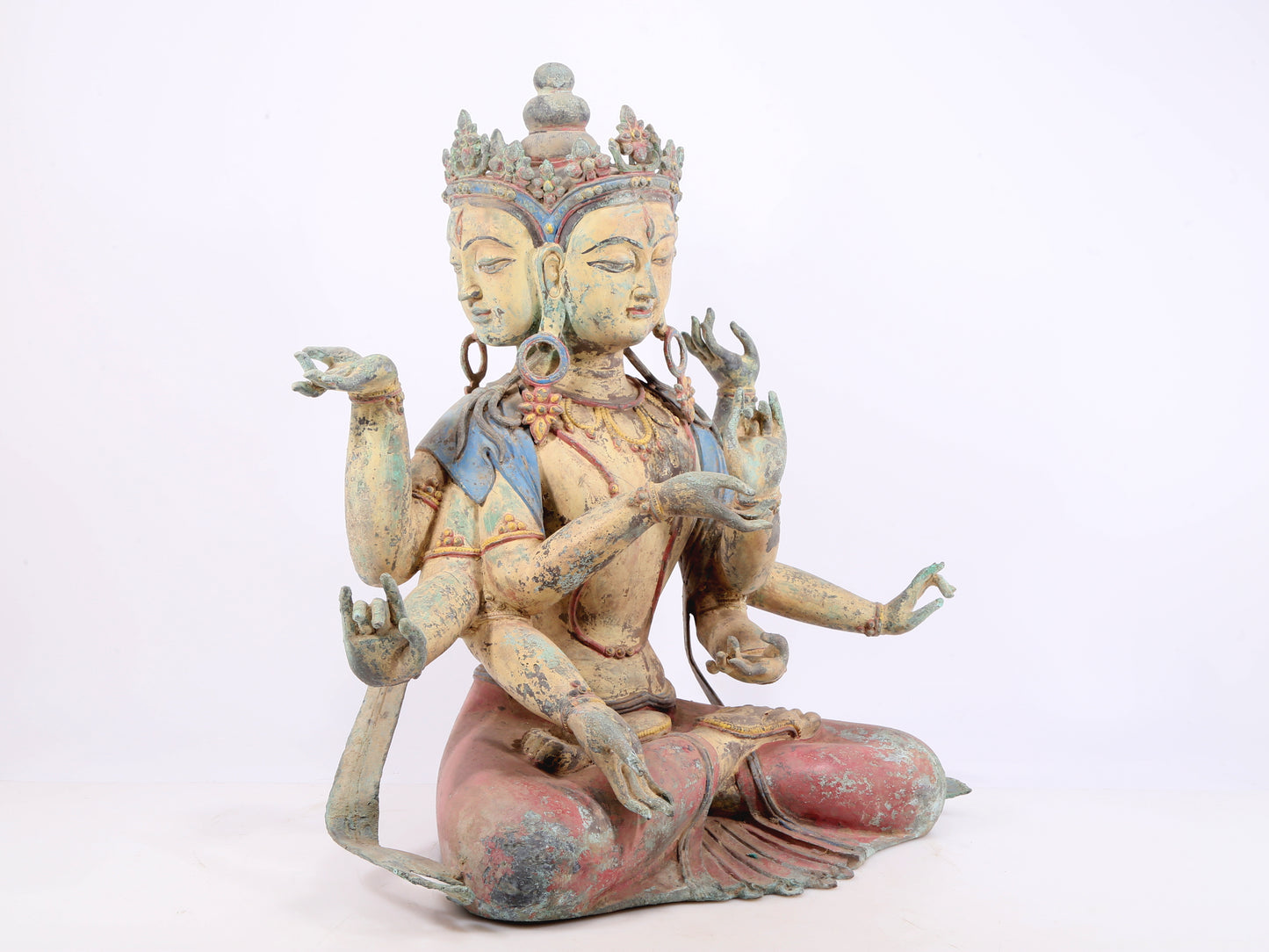 A solemn bronze painted eight-armed Guanyin statue