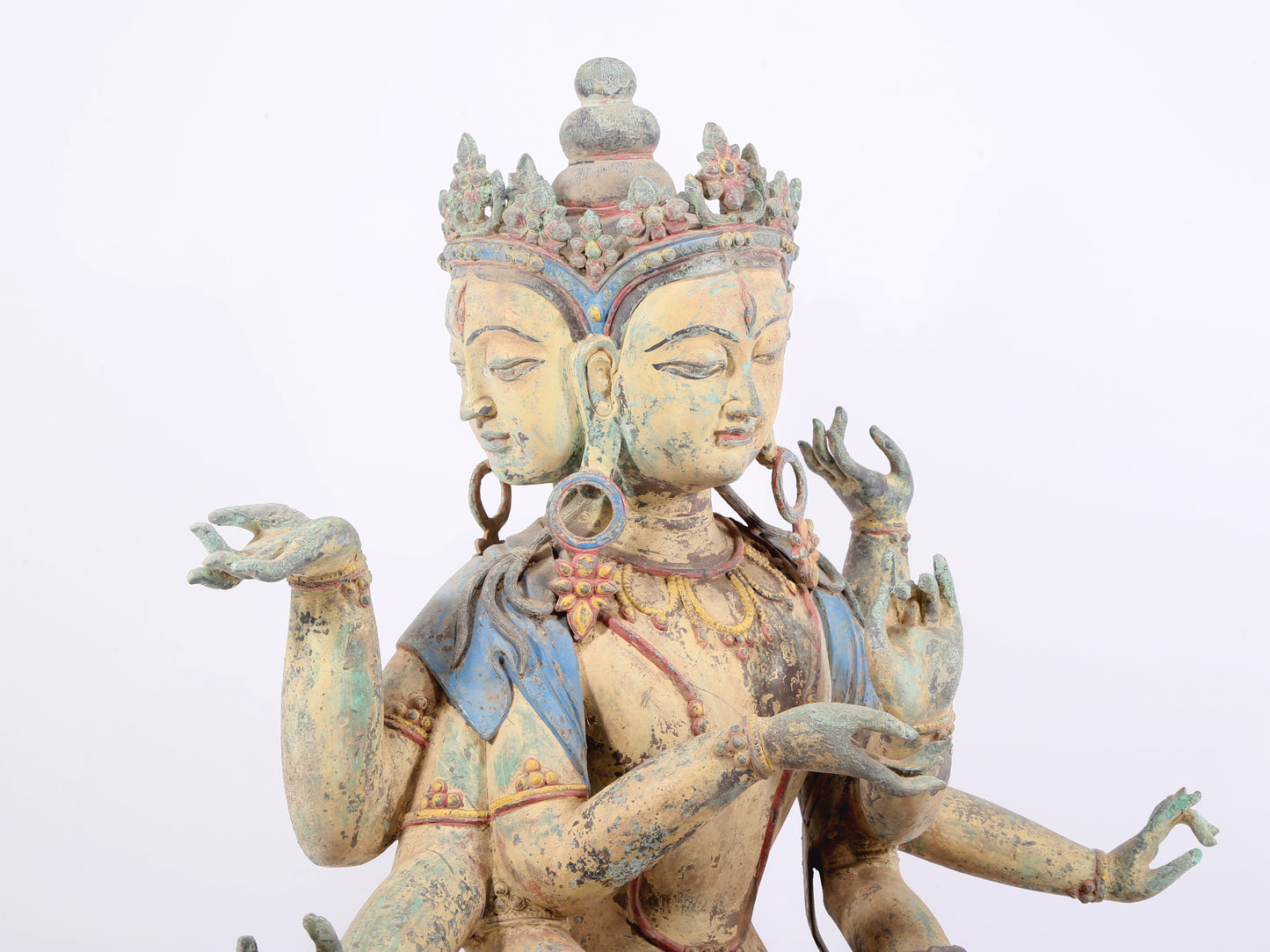 A solemn bronze painted eight-armed Guanyin statue