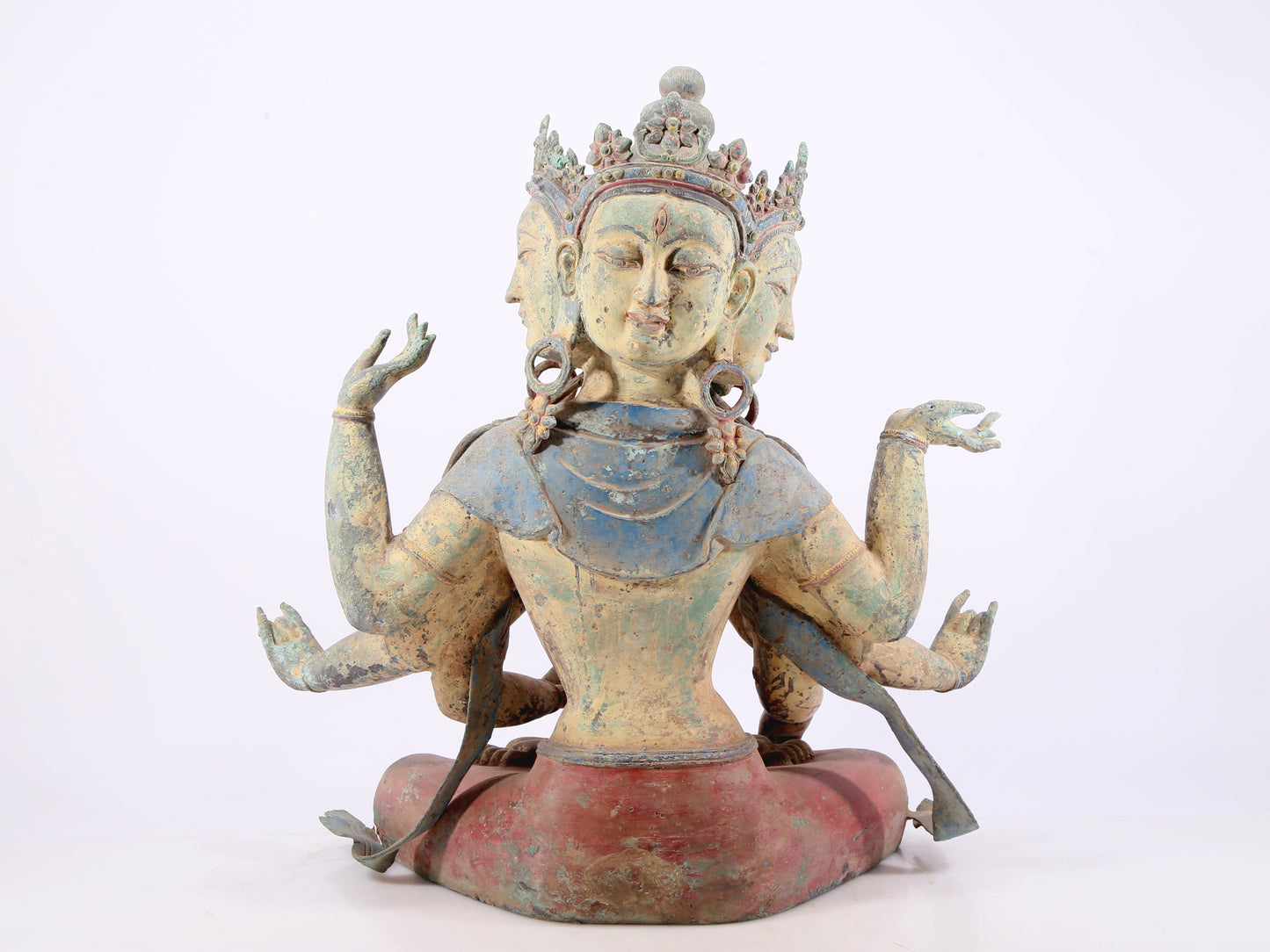 A solemn bronze painted eight-armed Guanyin statue