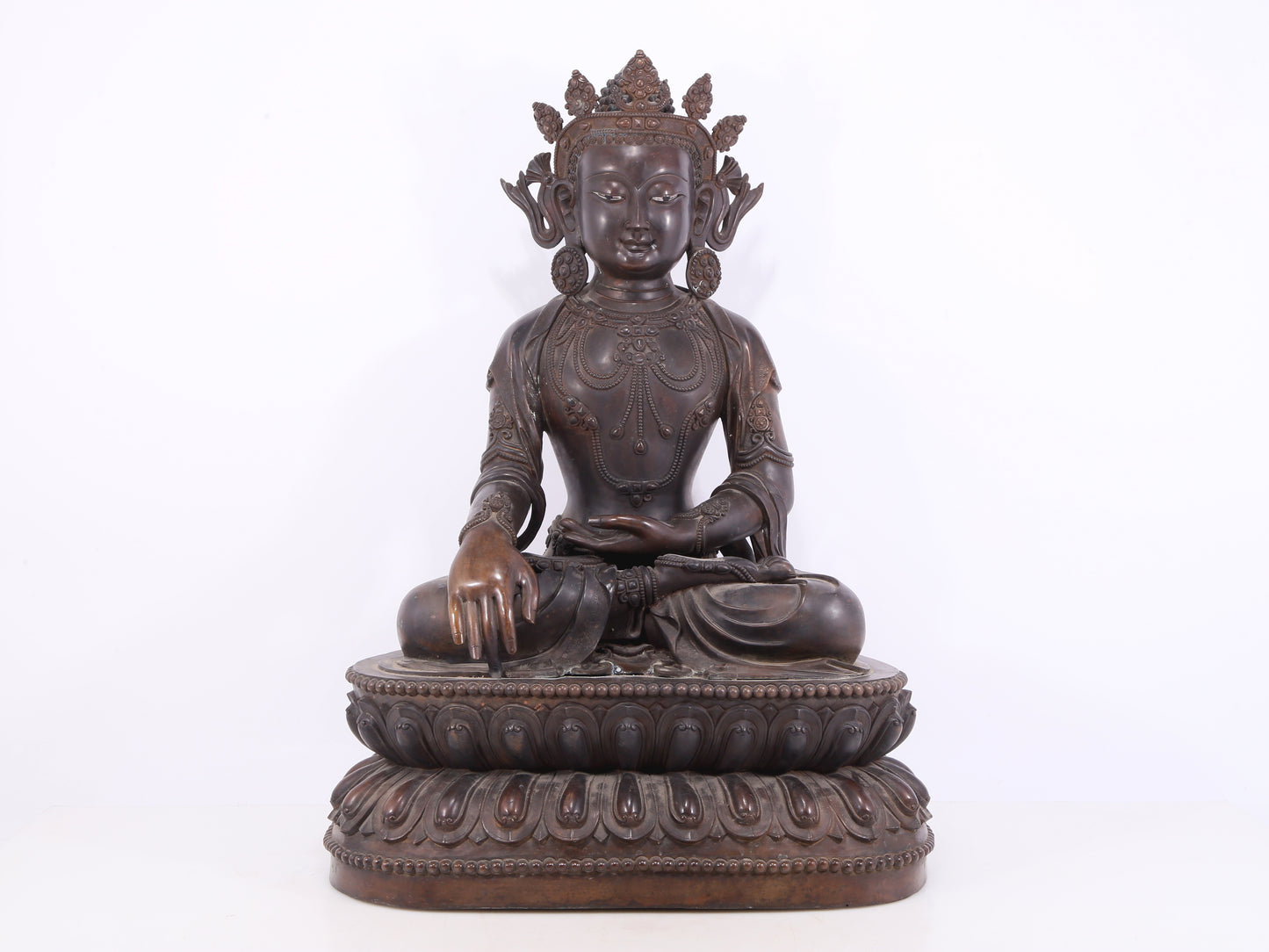 A solemn bronze Buddha statue