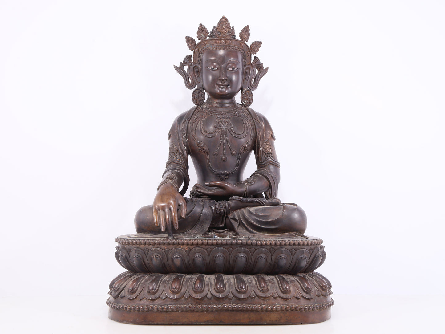 A solemn bronze Buddha statue