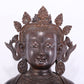 A solemn bronze Buddha statue