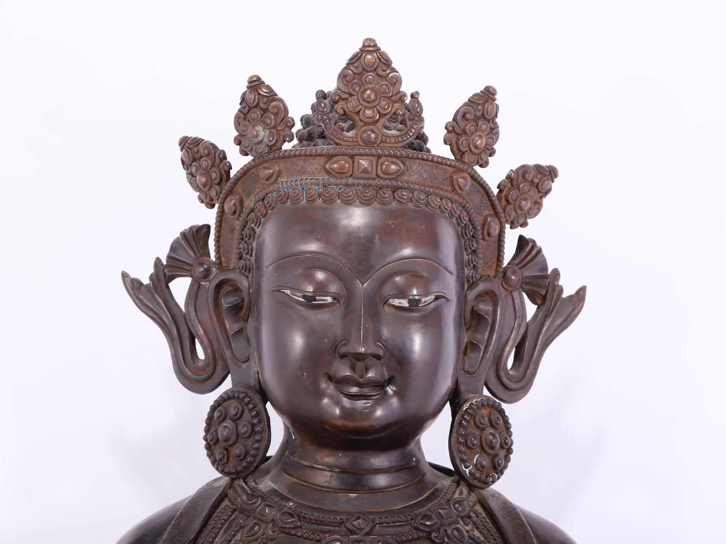 A solemn bronze Buddha statue