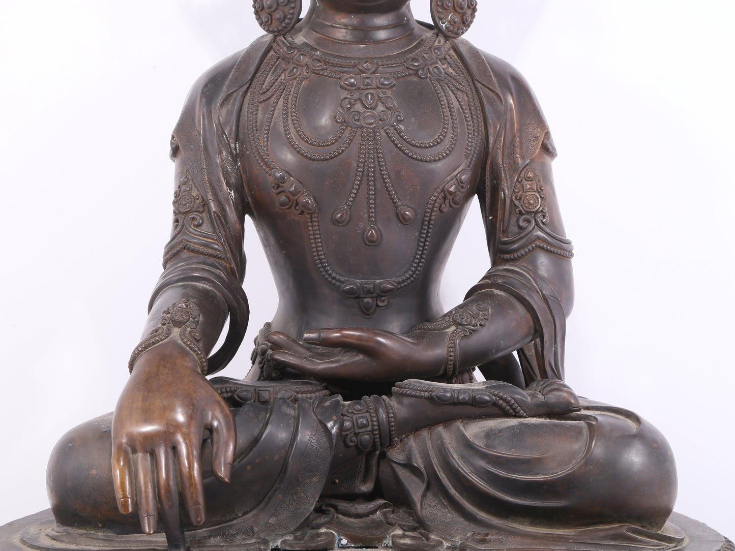 A solemn bronze Buddha statue