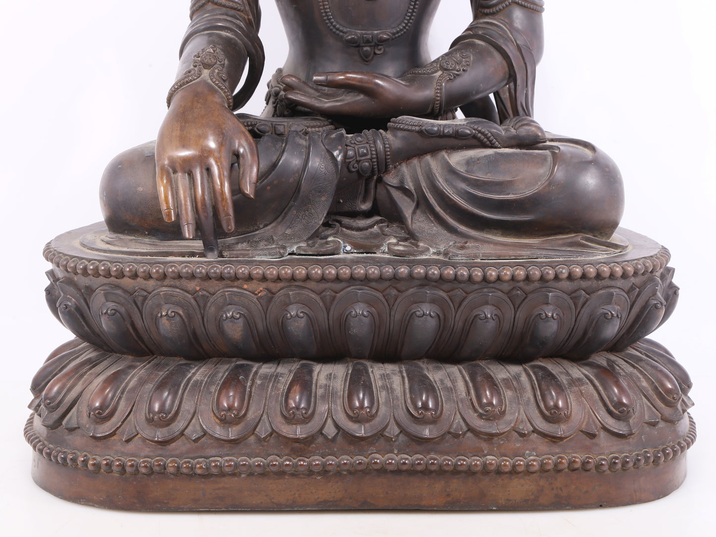 A solemn bronze Buddha statue