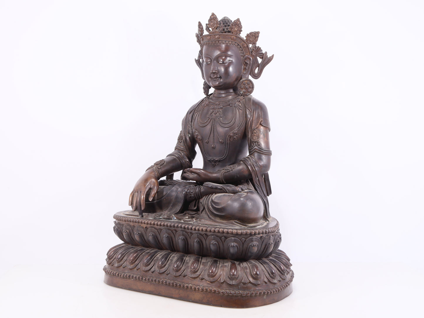 A solemn bronze Buddha statue