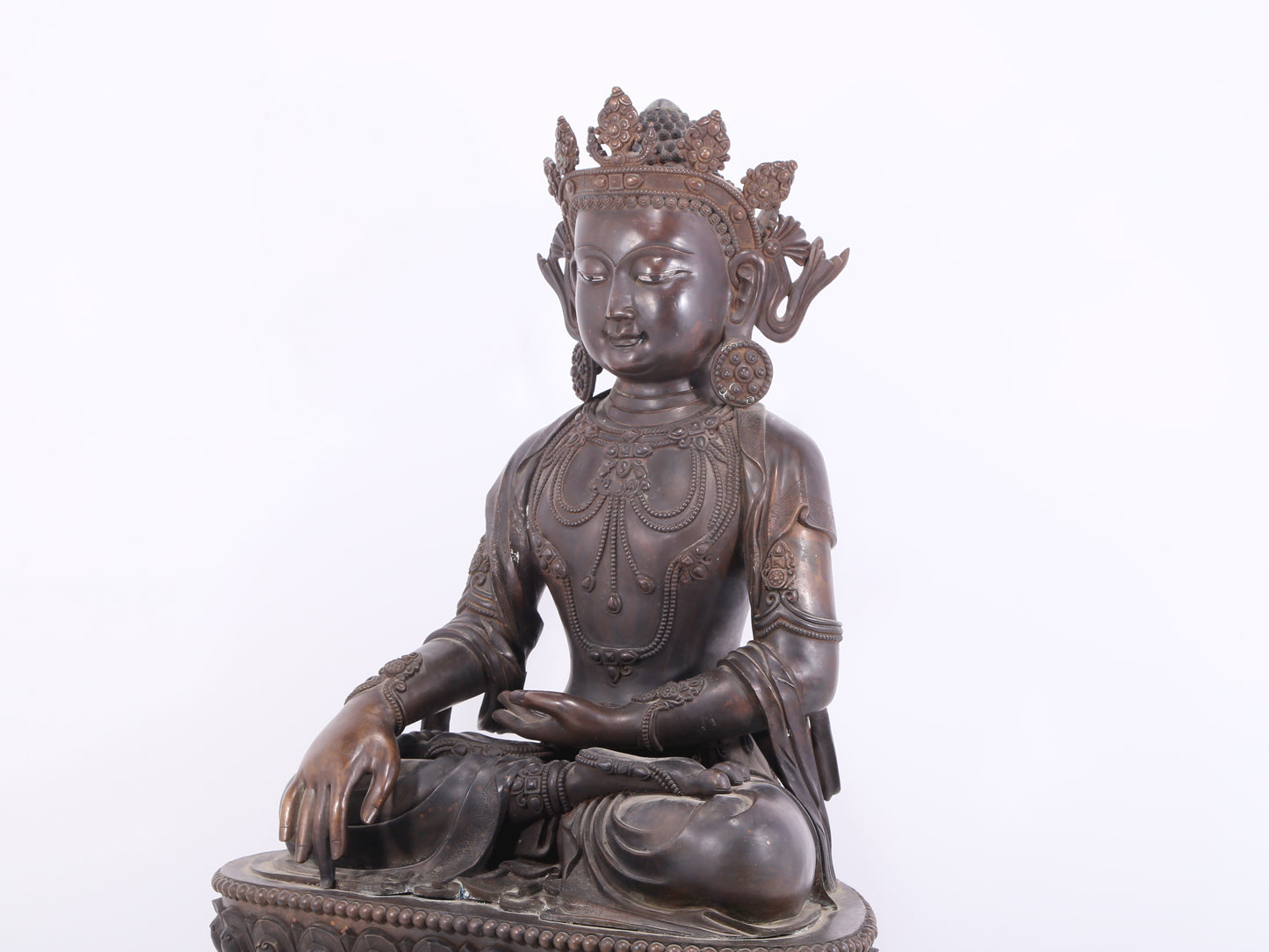 A solemn bronze Buddha statue