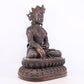 A solemn bronze Buddha statue