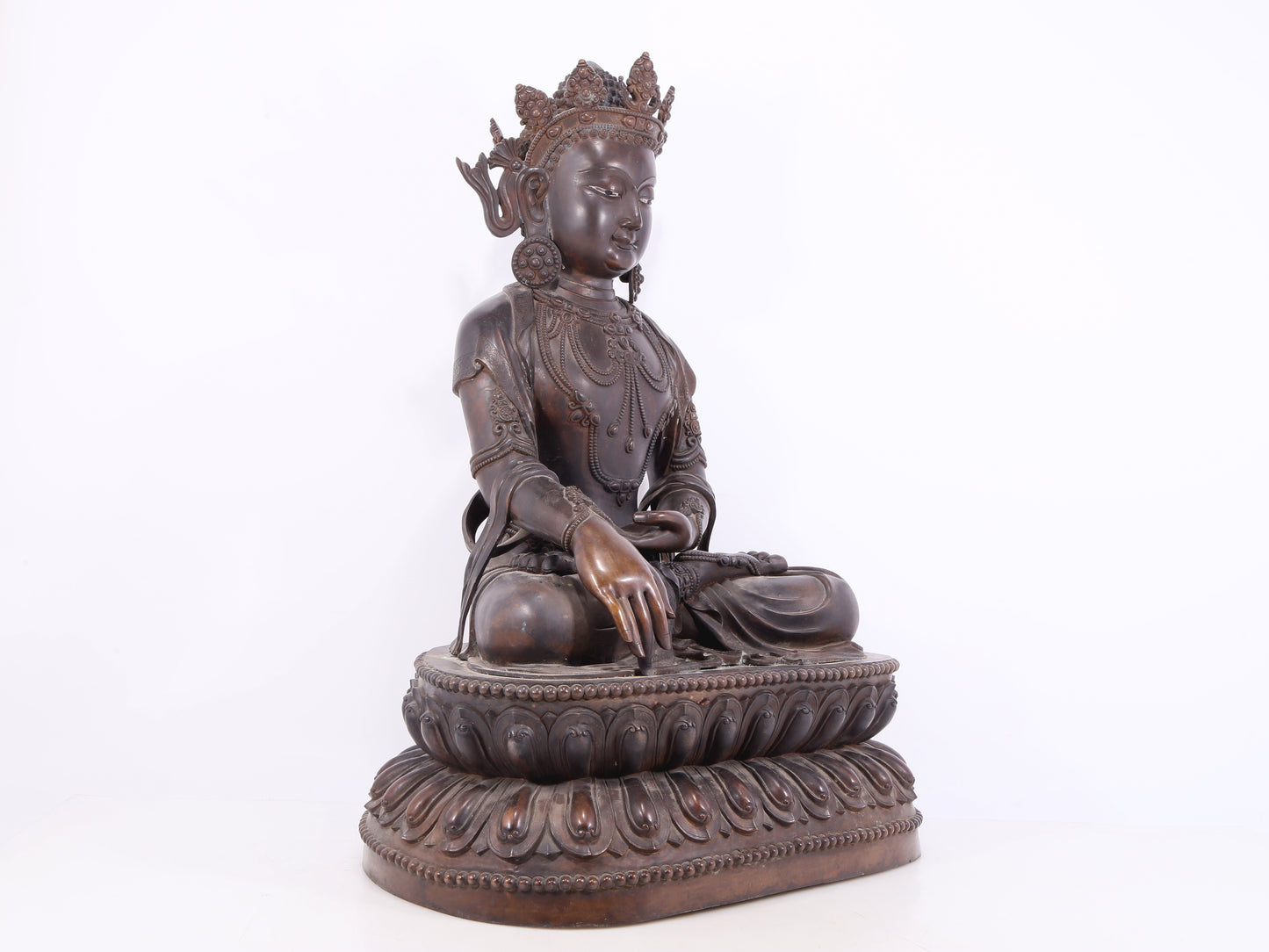 A solemn bronze Buddha statue