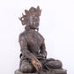 A solemn bronze Buddha statue