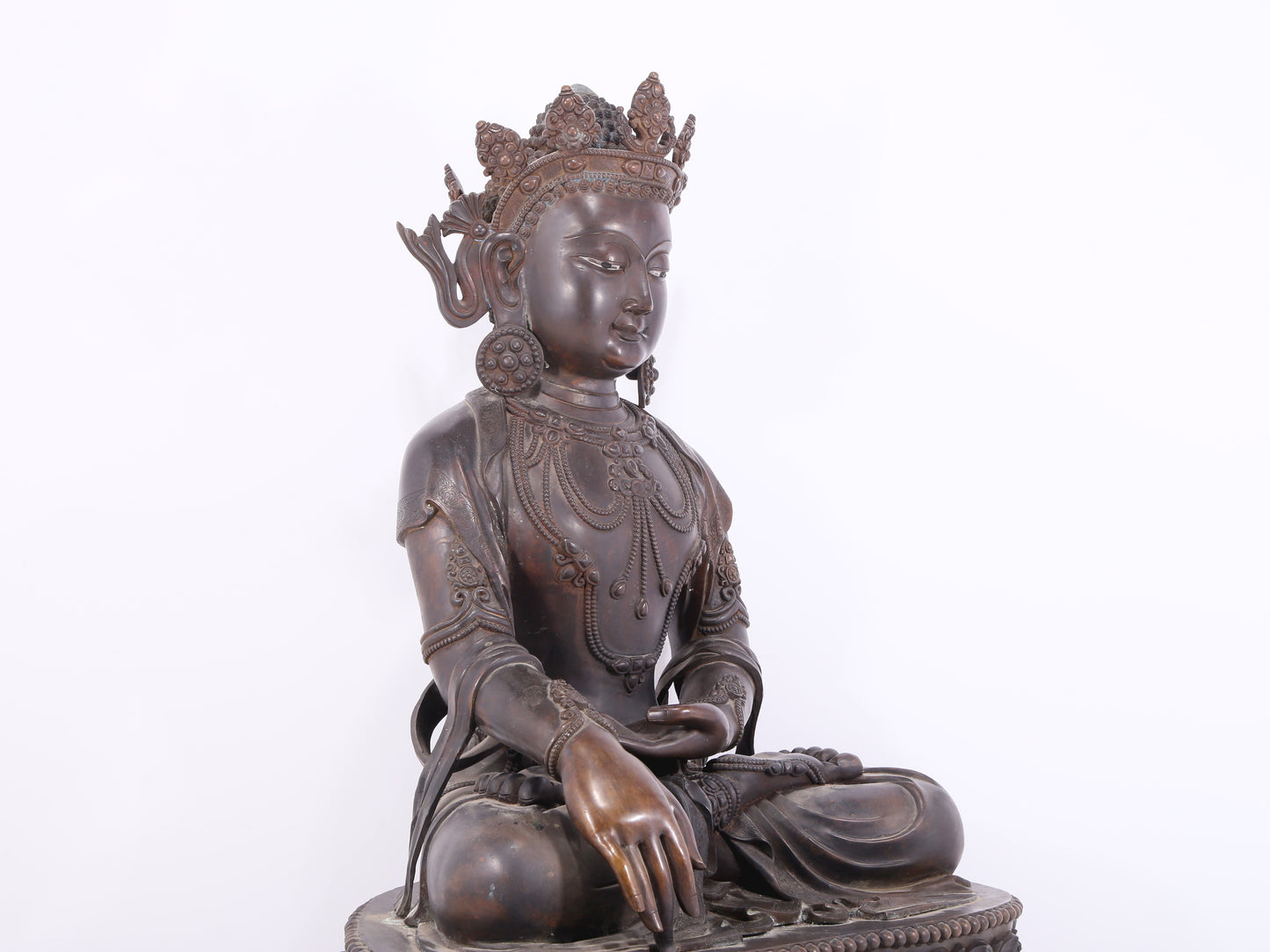 A solemn bronze Buddha statue