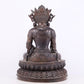 A solemn bronze Buddha statue