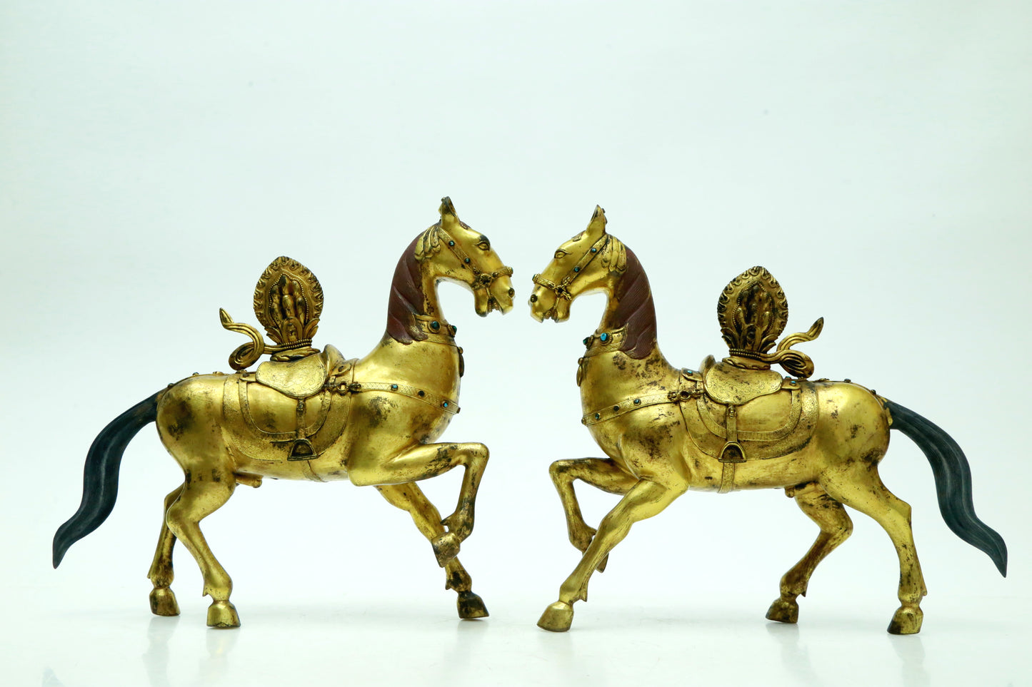 A Brilliant Pair Of Gilt-Bronze Horses