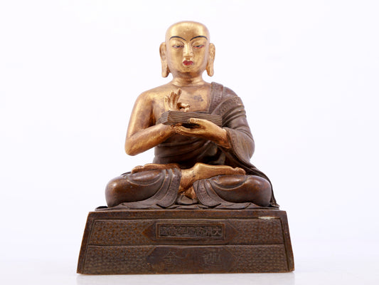 A gilt bronze Arhat statue