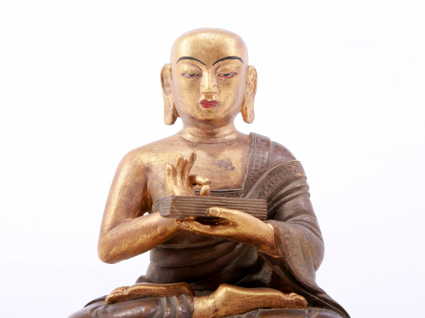 A gilt bronze Arhat statue