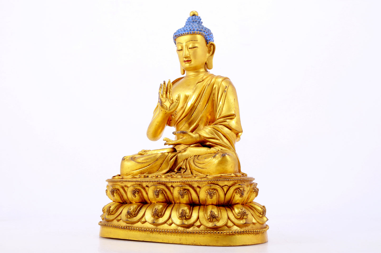 A gilt bronze statue of Gautama Buddha