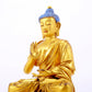 A gilt bronze statue of Gautama Buddha