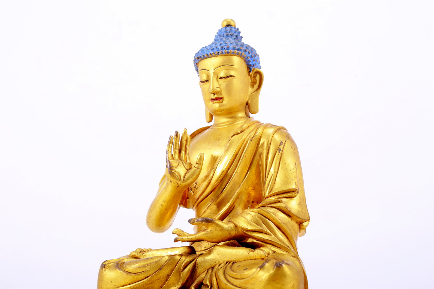 A gilt bronze statue of Gautama Buddha