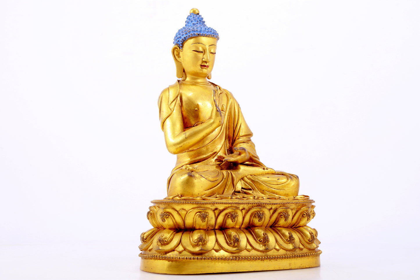 A gilt bronze statue of Gautama Buddha