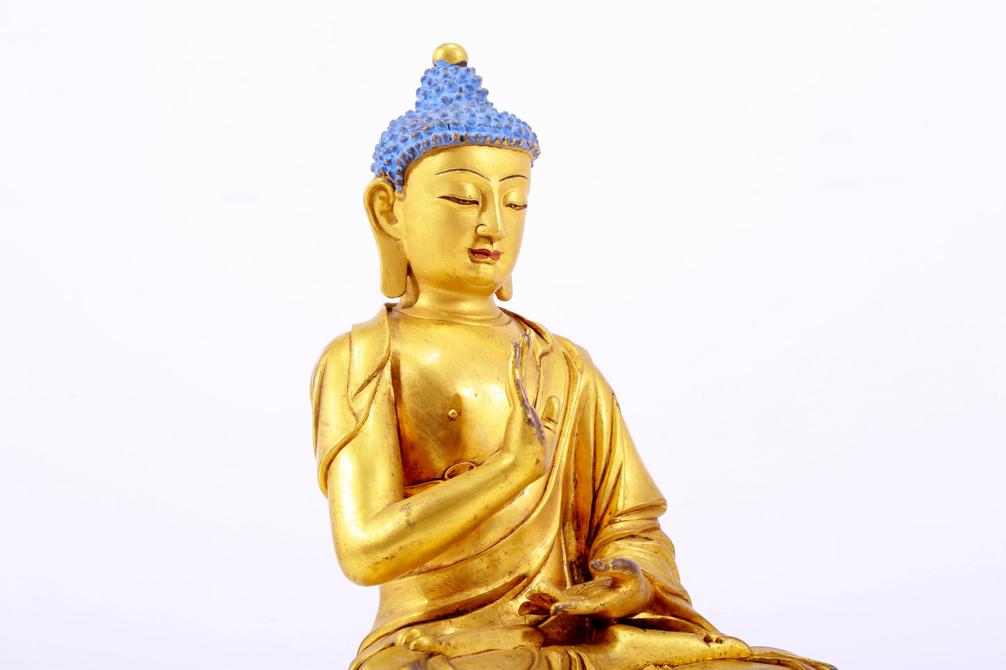 A gilt bronze statue of Gautama Buddha