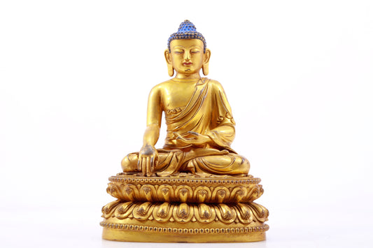 A gilt bronze statue of Gautama Buddha